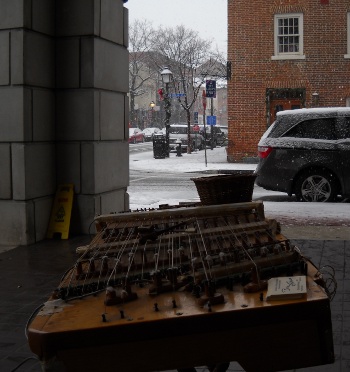 The dulci set up in old town as snow falls, looking across it legtwise from one end