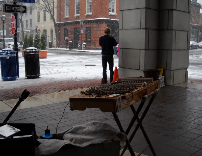 The dulci set up in old town as snow falls
