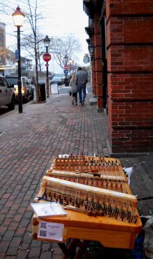 the dulcimer set up with a couple walking away together