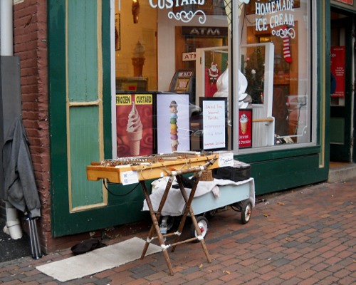 The dulcimer set up in front of the icecream shop