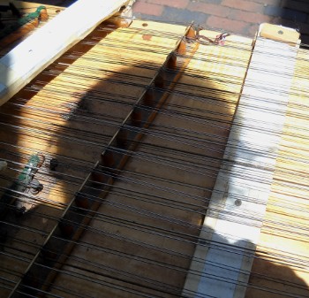 Brian's shadow on the face of the dulcimer