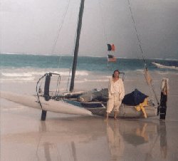 brian with the hydrofoil trimarran Further on the beach in Tullum after crossing the gulf solo