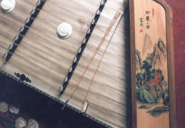 a chinese dulcimer with beautiful painted sidepanels