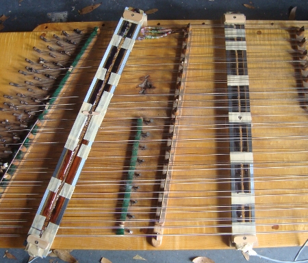 dulcimer with uncovered pickes mounted, copper coils showing